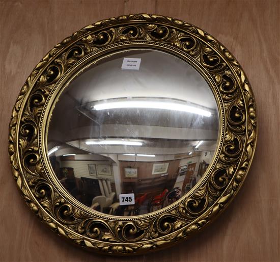 A gilt framed convex wall mirror W.54cm
